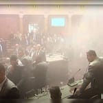 Serbian Lawmakers Disrupt Parliament With Flares, Bombs To Support Protests